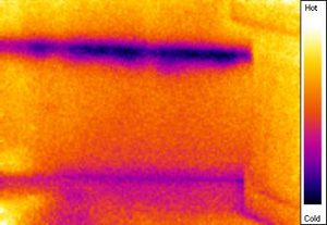 Hidden Water Line IR imaging shows air conditioning condensate drip line behind drywall that caused condensation and mold growth on back side of drywall - was not visible with naked eye during real estate mold and IR moisture inspection and would have remained hidden without IR survey of basement.